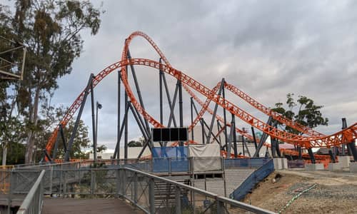 Steel Taipan rises over Log Ride rubble at Dreamworld